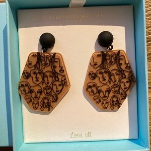 Human face hanging earrings